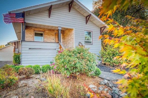 A single-story house with a front porch, a mailbox, and a mailbox number 1026.