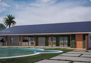 Un edificio moderno con piscina, ventanas amplias y techo plano.