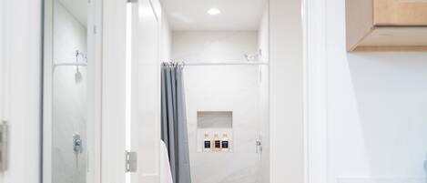 Shower, hair dryer, towels, soap