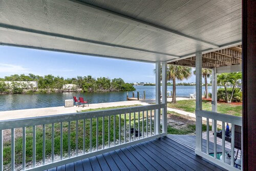 Sitting at the Dock on the Bay Waterfront Pool Home