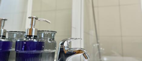 Hair dryer, towels, soap, toilet paper
