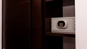A white electronic device on a shelf, possibly a security or control panel. - Mojarra: Suites with Balcony in Cancún Heart (Cancún)