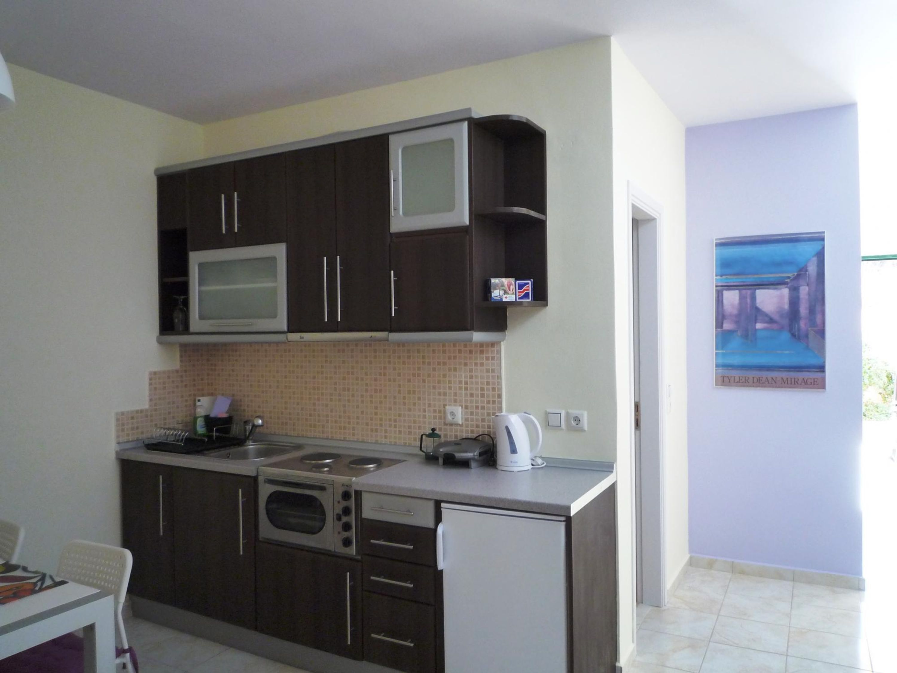Fridge, coffee/tea maker, toaster, cookware/dishes/utensils