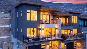 A modern multi-story house with large windows, balconies, and a stone facade. - Apex Ridge Retreat by Avantstay Private Hot Tub + Fireplace + Mountain Views + Near Deer Valley East (Kamas)