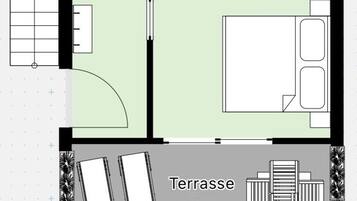 A floor plan with a bathroom, toilet, shower, and a terrace area.