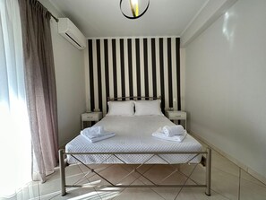 1 habitación, tabla de planchar con plancha, wifi gratis y ropa de cama 