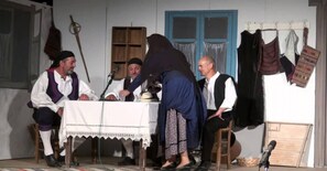 A stage with a table, chairs, and a microphone. - EAR - house  Karia Lefkada (Lefkada)