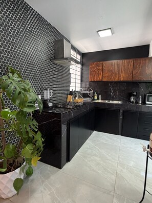 Fridge, microwave, stovetop, coffee/tea maker