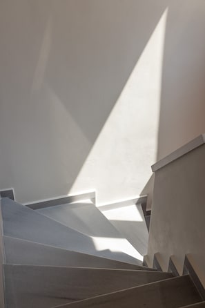 A staircase with a geometric design, leading upwards.