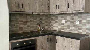Coffee/tea maker, fridge, microwave, spices