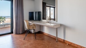 A modern room with a desk, chair, and large window. - Bliss Villa 3 with private swimming pool (Anissaras)