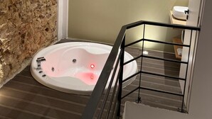 A modern bathroom with a freestanding bathtub, a toilet, and a shower area. - No 2 - Theo Apartment two bedrooms ground floor (Athina)