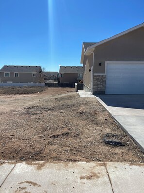 A residential area with houses, a driveway, and a garage.