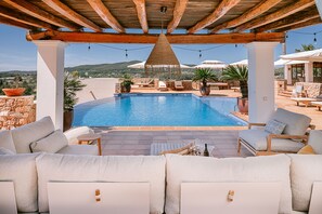 A pool area with lounge chairs, a pergola, and a view of the landscape. - Santa Gertrudis 1  in Santa Gertrudis de Fruitera (Santa Gertrudis de Fruitera)
