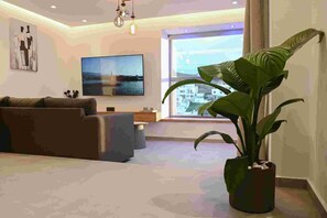 TV - MGK Luxury Suites with a private  pool, ligaria (Ammoudi)
