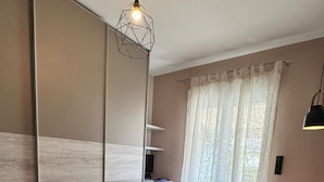 A modern bedroom with a large bed, a desk, and a chair. - Athens Heart Acropolis Balcony (Athens)