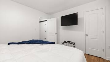 1 bedroom, desk, iron/ironing board, travel crib