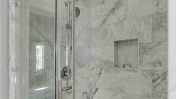 Shower, hair dryer, towels, shampoo