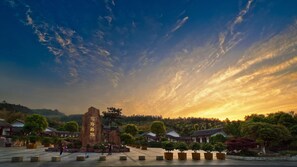 A traditional building with a large stone monument in the center, surrounded by trees and a clear sky. - Crowne Plaza Suzhou Taihu Lake By Ihg (Suzhou)