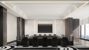 A modern conference room with a large flat-screen TV, a long table with chairs, and a patterned carpet. - Crowne Plaza Suzhou Taihu Lake By Ihg (Suzhou)