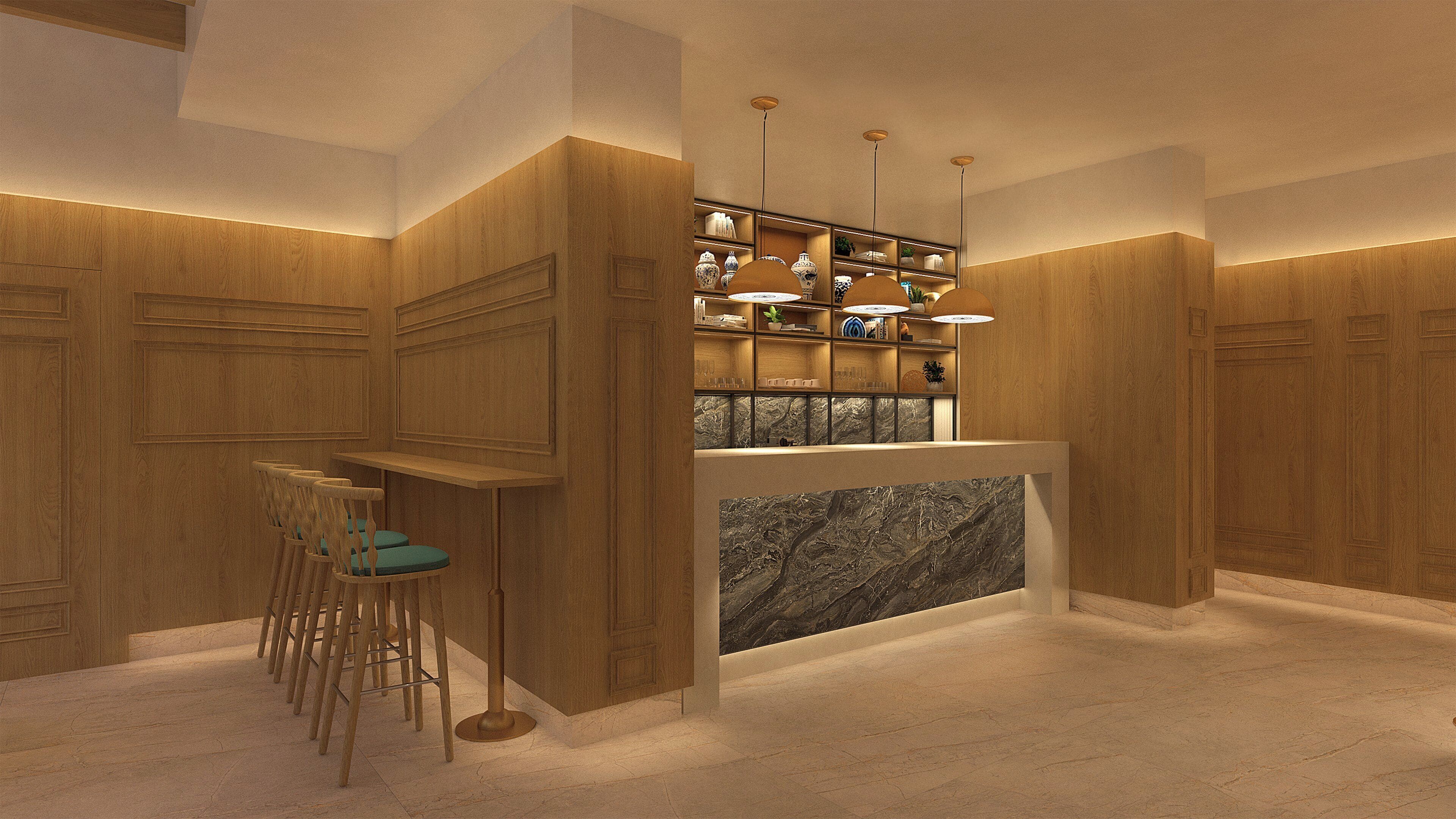 Una zona de bar con paneles de madera, encimera de mármol y taburetes.