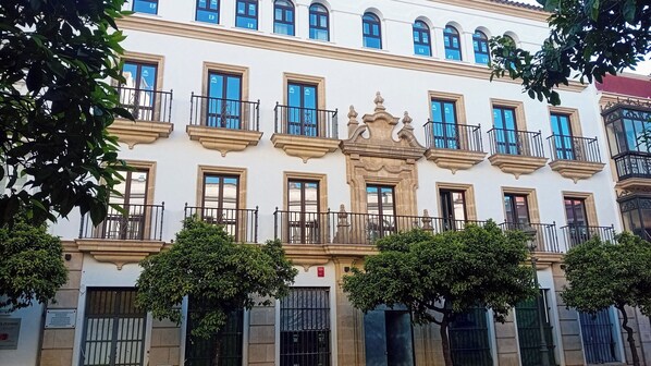 A multi-story building with balconies, large windows, and a classical architectural style. - Casa Del Compositor, Vignette Collection by IHG (Jerez de la Frontera)