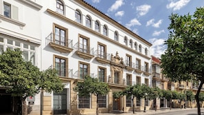 A multi-story building with a classic architectural style, featuring balconies and large windows. - Casa Del Compositor, Vignette Collection by IHG (Jerez de la Frontera)
