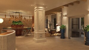 A spacious lobby with a reception area, seating arrangements, and decorative plants. - Casa Del Compositor, Vignette Collection by IHG (Jerez de la Frontera)