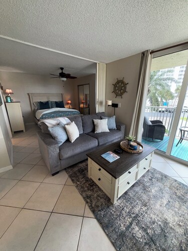 Beautiful 1bd/1ba beach condo feet from the pool & all the sand & water you want