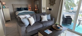 Beautiful 1bd/1ba beach condo feet from the pool & all the sand & water you want
