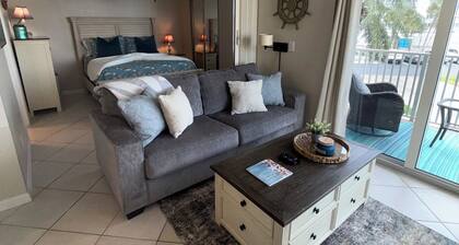 Beautiful 1bd/1ba beach condo feet from the pool & all the sand & water you want