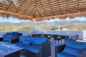 Outdoor dining - Beautiful modern house with a rustic palapa shade (Agua de la Costa)