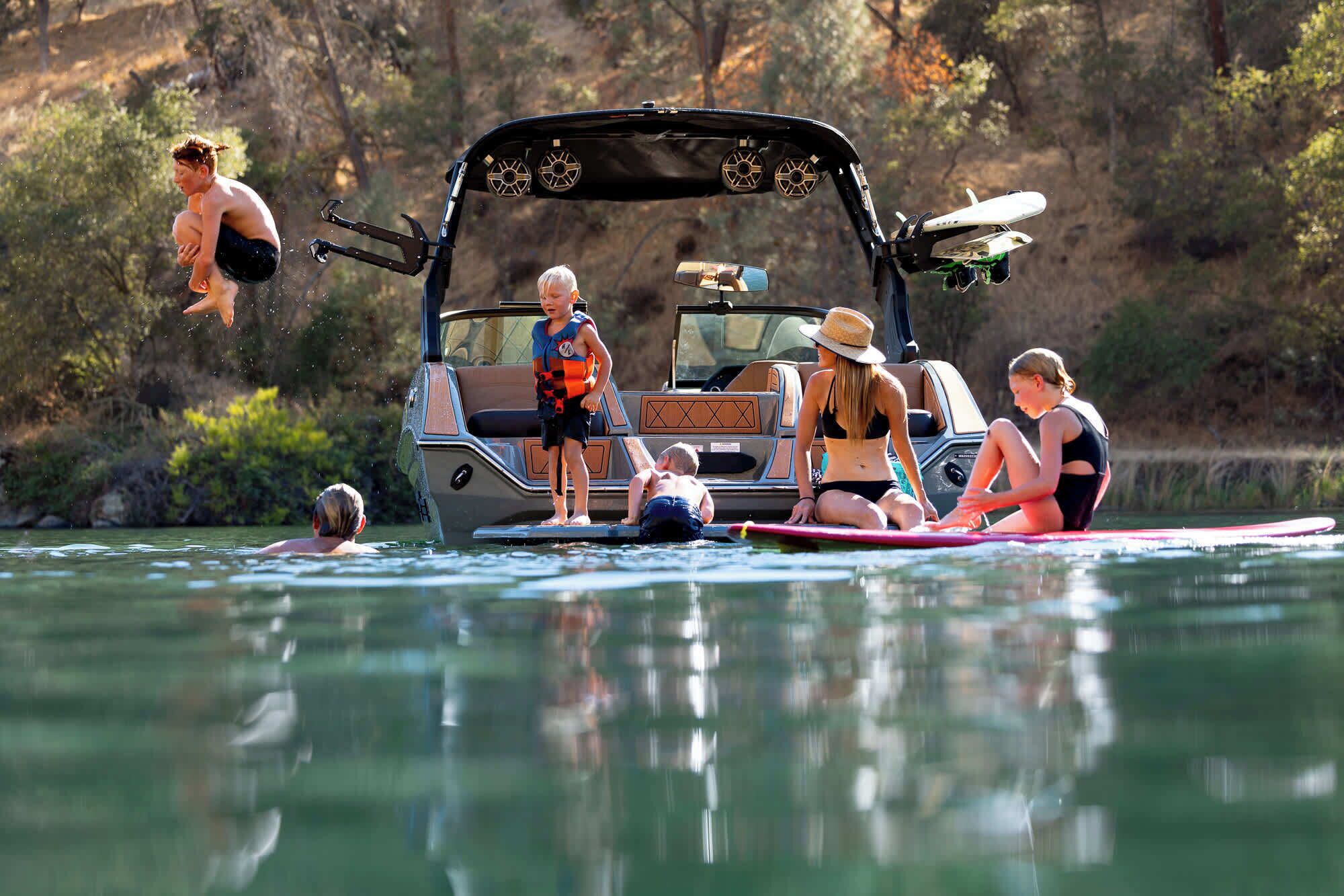 A boat with a cabin, equipped with a canopy and seating for passengers.