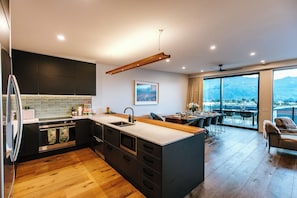 House, Lake View | Private kitchen | Full-size fridge, microwave, oven, stovetop - Korari House - Lake Views - Sleeps 10 (Wānaka)