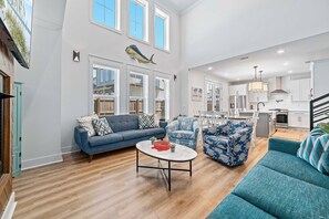 TV, fireplace - The Salty Kiss at Redfish Harbor | Boat Slip | Dog-Friendly | Outdoor Pool | Beach Getaways (Pensacola)