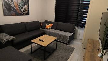 Appartement Deluxe, balcon, vue ville | Coin séjour