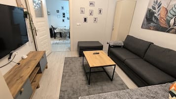 Deluxe-Apartment, Balkon, Stadtblick | Wohnbereich