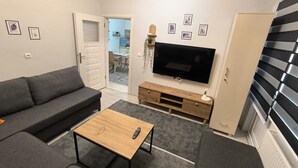 Leilighet – deluxe, balkong, byutsikt | Oppholdsområde