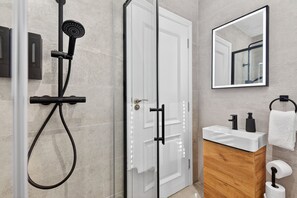 Shower, hair dryer, towels, soap