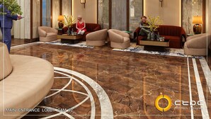 A modern lobby with marble flooring, sofas, and decorative plants. - Goldfinch Panjim Goa (Panaji)