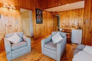 Superior chalet, uitzicht op tuin | Woonruimte