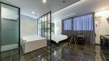 Suite, City View | Desk, laptop workspace, blackout drapes, free WiFi