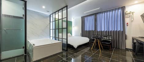 Suite, City View | Desk, laptop workspace, blackout drapes, free WiFi