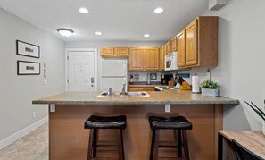 Private kitchen - Condo in downtown Ludington, perfect for a cozy getaway. (Ludington)