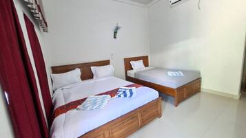 Kamar Triple Klasik, Bebas Asap Rokok, pemandangan kebun | Wi-Fi gratis