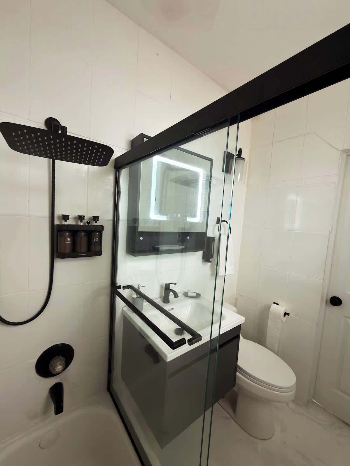 Shower, hair dryer, towels, shampoo