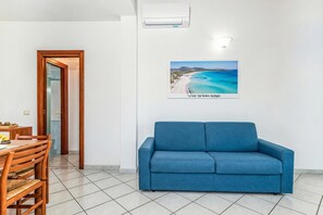 Family Apartment, 2 Bedrooms, 2 Bathrooms (Tavolara Sea View Apartments 2) | Living area - Tavolara Sea View Apartments (San Teodoro)