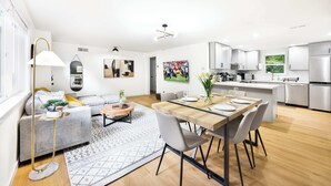 A modern apartment with a dining area, kitchen, and living room. - Newly Modern 4BR2BA Rambler by Super Market (Shoreline)