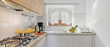 Family Apartment, Multiple Bedrooms (Toscolano Olive House) | Private kitchen | Fridge, oven, stovetop, dishwasher