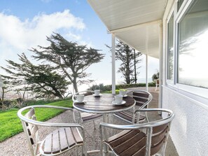 Outdoor dining - Superb sea views from a ground floor apartment, set in tranquil grounds. (Seaton)